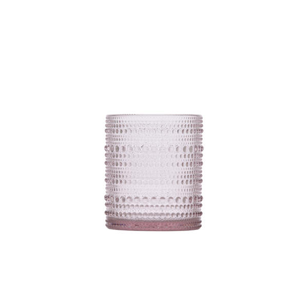 A stylish Jupiter Blush 10 oz glass with a beautiful blush pink tone and ridged texture, ideal for serving beverages at weddings, parties, or elegant gatherings.