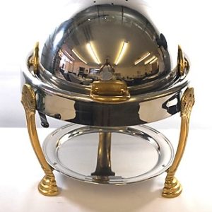A round chrome and brass chafer with a roll top lid, designed to keep food warm and accessible for events such as buffets, weddings, and corporate gatherings.
